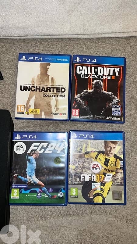 PS4 slim with games and controller 1