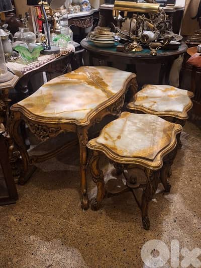 3 tables set wood and marble on top