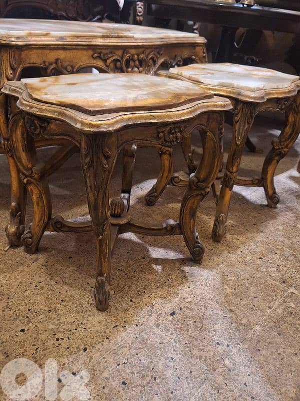 3 tables set wood and marble on top 4