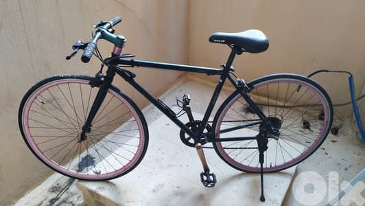 Bicycle with helmet and air pump بسكليت