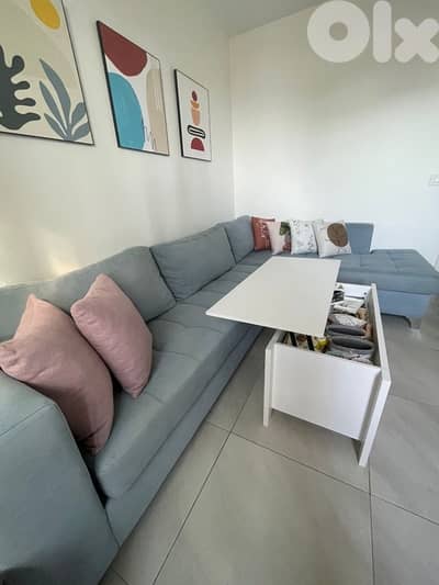 Table that opens to become closer to seat