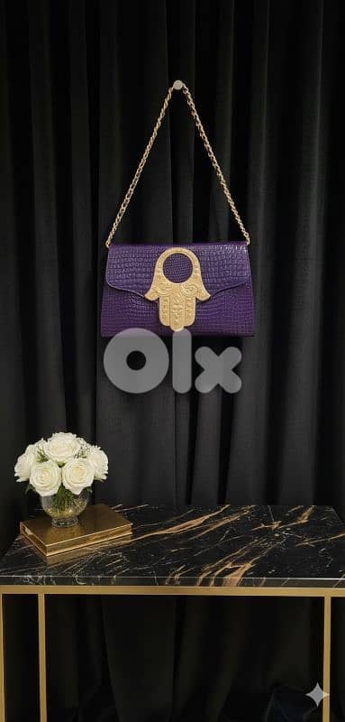 purple leather clutch