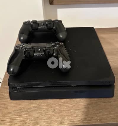 ps4 slim 1tb with 3 games and 2 controllers  (half used)