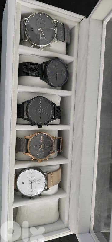 4 MVMT watches and 1 omorfia watch and box