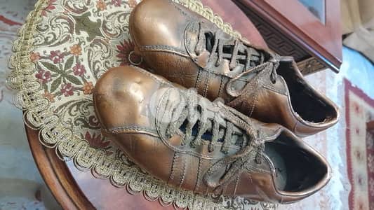 this is a cooper bronze football shoes (adidas)