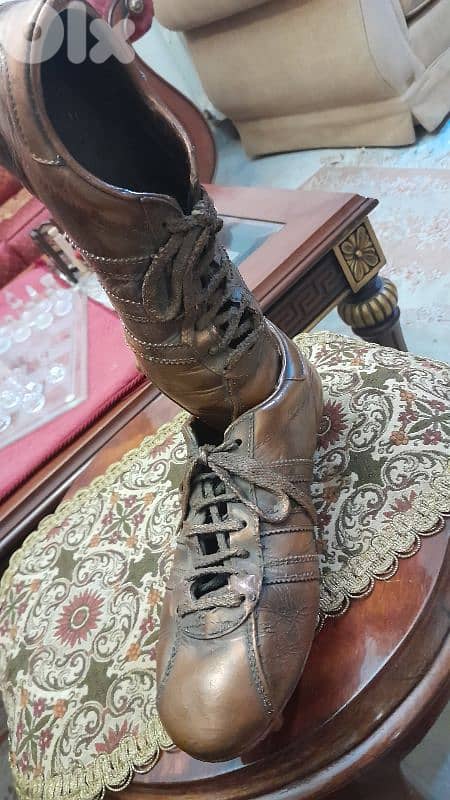 this is a cooper bronze football shoes (adidas) 2