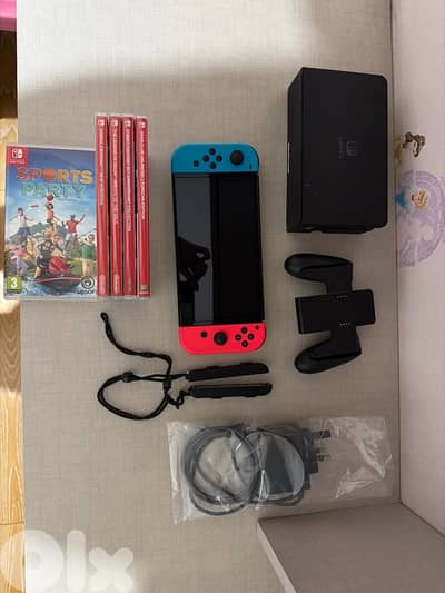 Nintendo switch oled model + 5games like new not used