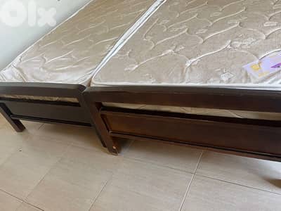 2 single beds and mattresses