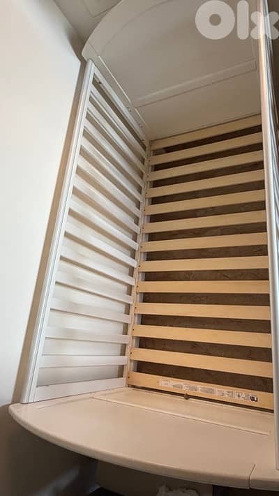 white wood bed with mattress