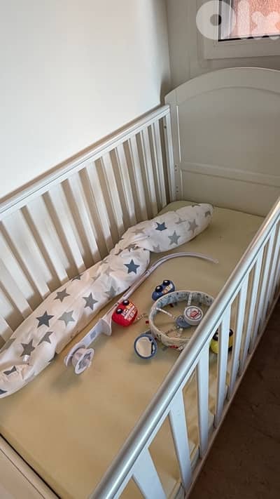 white wood bed with mattress