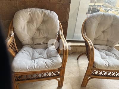 two bamboo chairs with its table