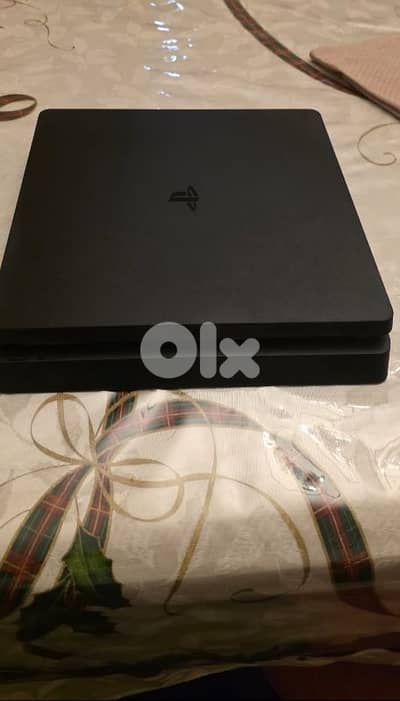 ps4 with 3 controllers and 7 games and steering wheel