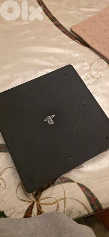 ps4 with 3 controllers and 7 games and steering wheel 2