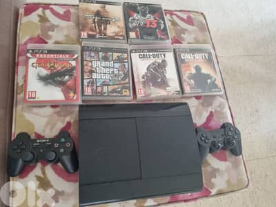 ps3 super slim with 6 games and 2 controllers