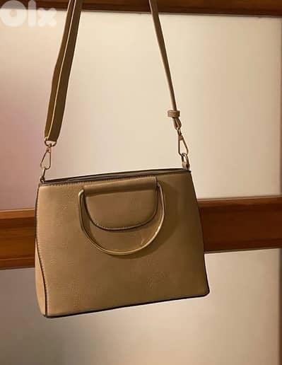 beige handbag and wallet
