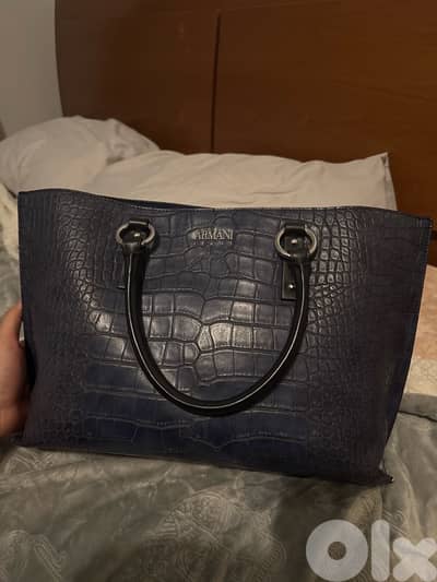 3 hand bags all new except for the prada one