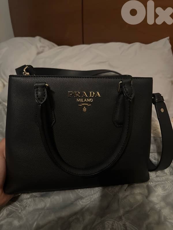 3 hand bags all new except for the prada one 3