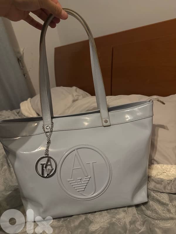 3 hand bags all new except for the prada one 6