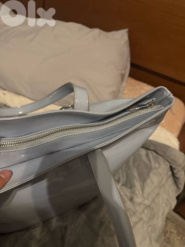 3 hand bags all new except for the prada one 8