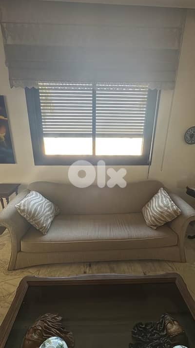 cream sofa with pillows