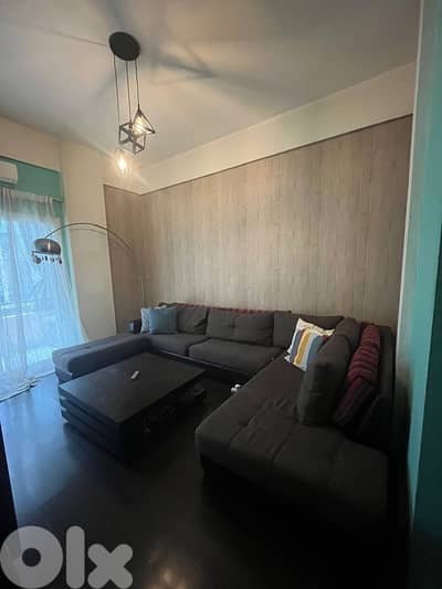 full livng room including big cabinet and bug woden table