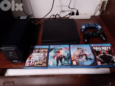PS4 slim + UPS + 2 controllers + 8 games + much more. . .