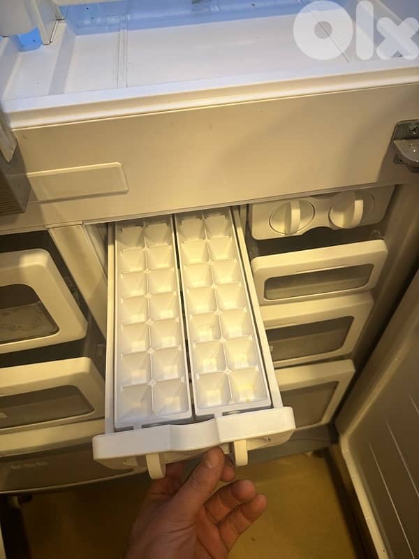 sharp fridge and a cooler 2