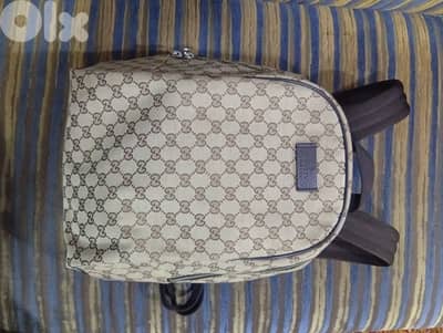100% authentic Gucci GG monogram canvas backpack with leather trim