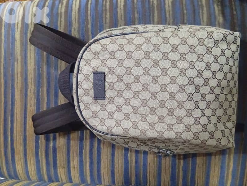 100% authentic Gucci GG monogram canvas backpack with leather trim 1