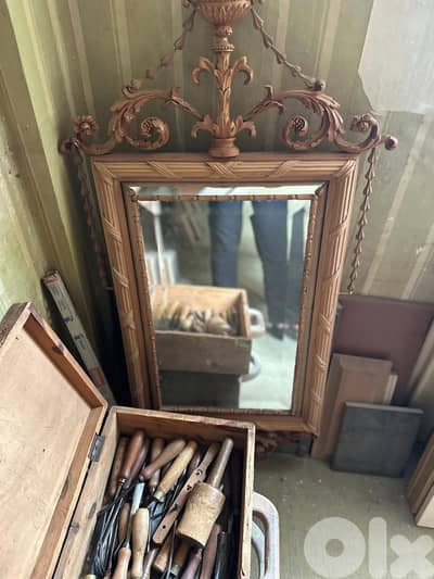 Mirror with a hand carved wooden frame