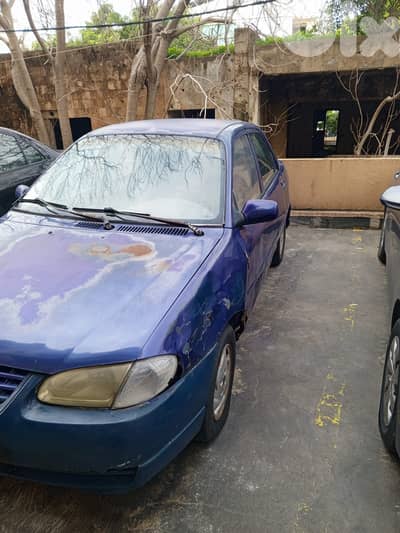 أنقاض)سيارة كيا مستعملة للبيع)