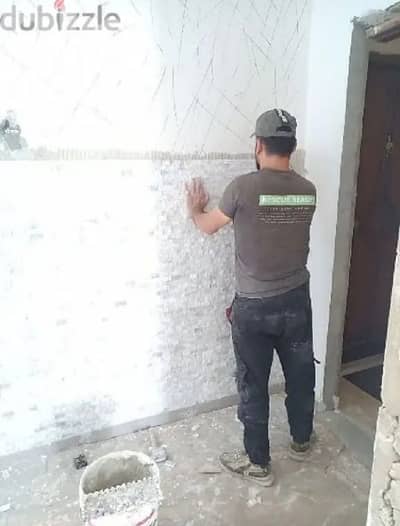 معلم بلاط وحجر ومجالي