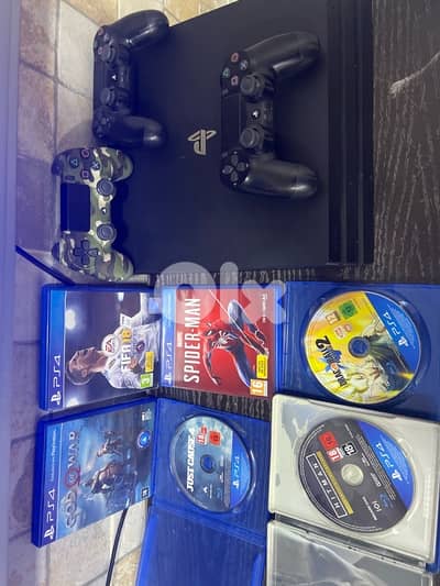 PS4 Pro with six cd and three controllers