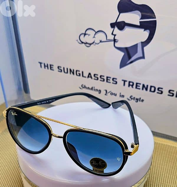 Ray-Ban sunglasses with gradient blue lenses. 1