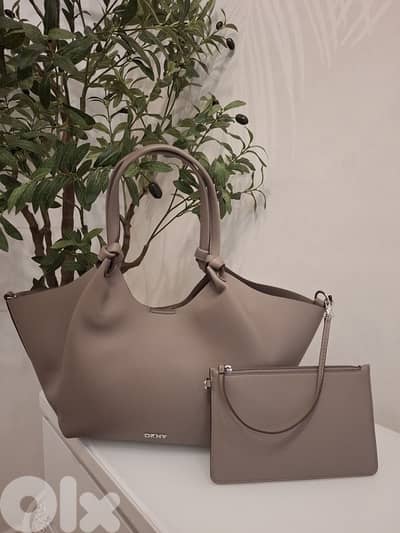 DKNY original new in tag with attached pouch