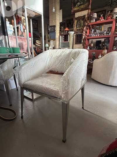 white chair stainless steel legs