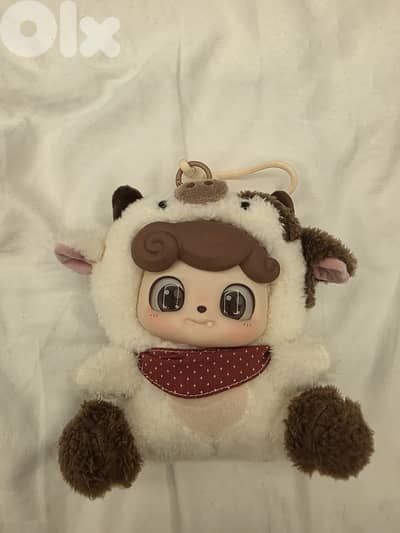 Q. Kid Animal Preschool Series plush pendant in the "Cow Cub" design.