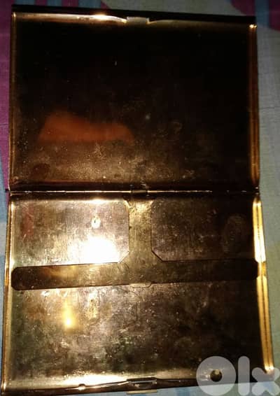 vintage metal case, likely a cigarette case