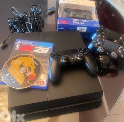 PS4 slim , 4 original controllers ( one still sealed ) , charging dock
