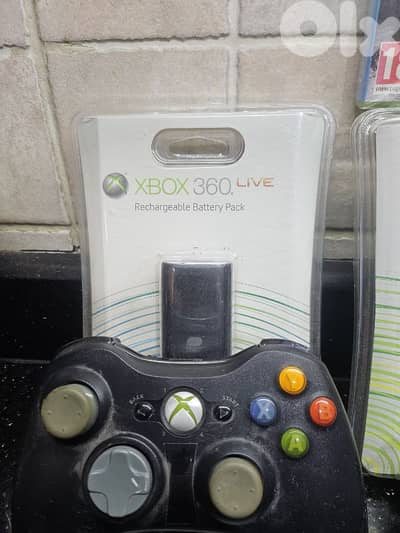 xbox 360 battery packs with controllers and CD