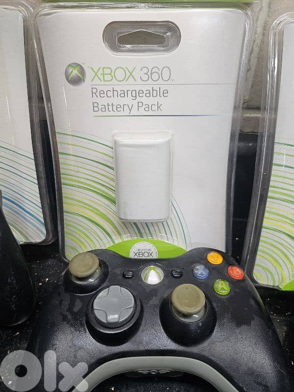 xbox 360 battery packs with controllers and CD 1