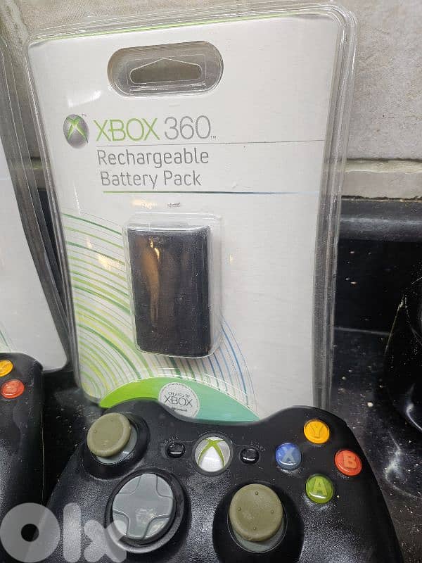xbox 360 battery packs with controllers and CD 2
