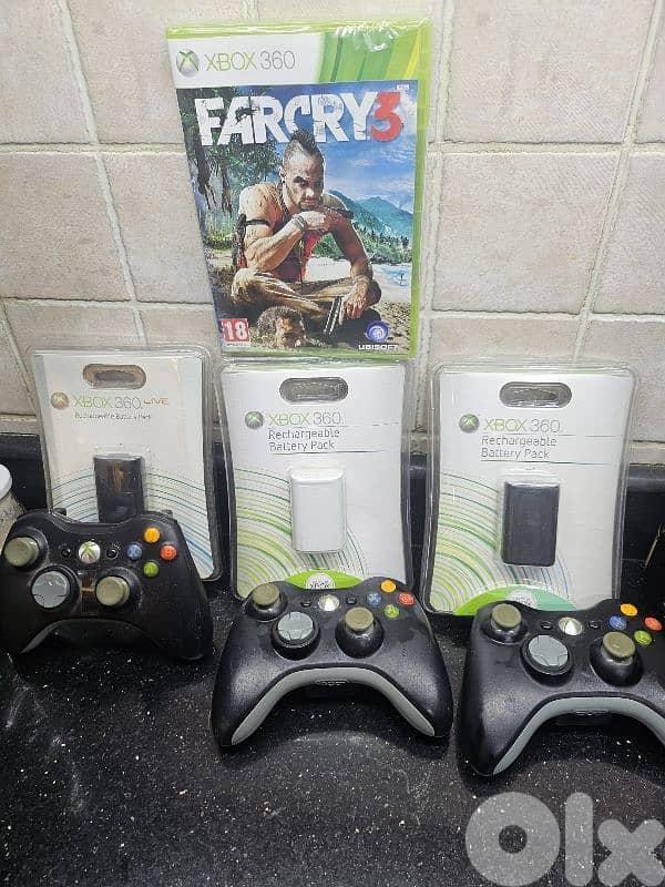 xbox 360 battery packs with controllers and CD 3