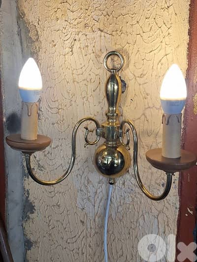 pair of large brass and wood wall lights