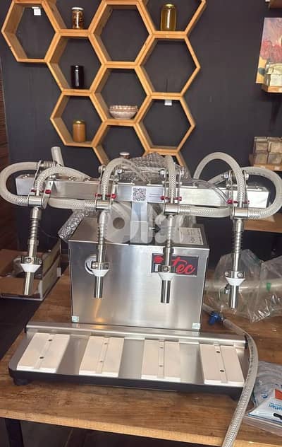 Filling machine of 4 heads(For Liquids) (آلة تعبئة بأربع رؤوس (للسوائل