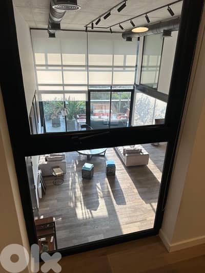 Amazing high ceiling loft designed with terrace