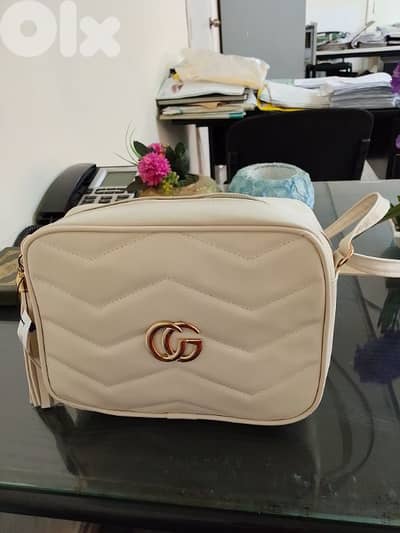 Gucci white bag.