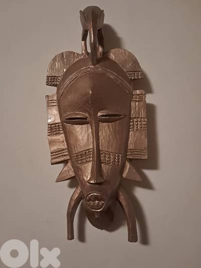 Sculpture murale visage africain