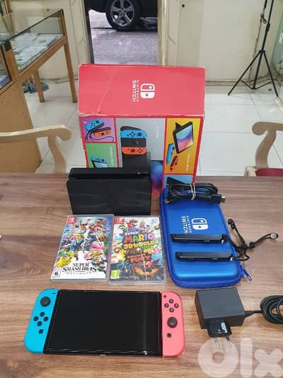 nintendo switch oled used like new with 2 games