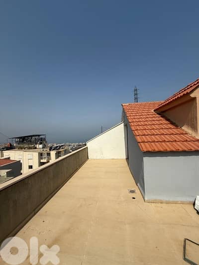 A furnished rooftop apartment with terrace in Awkar.